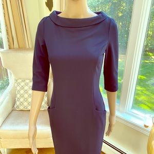 NWOT. Figure flattering navy Laura Bettini dress.